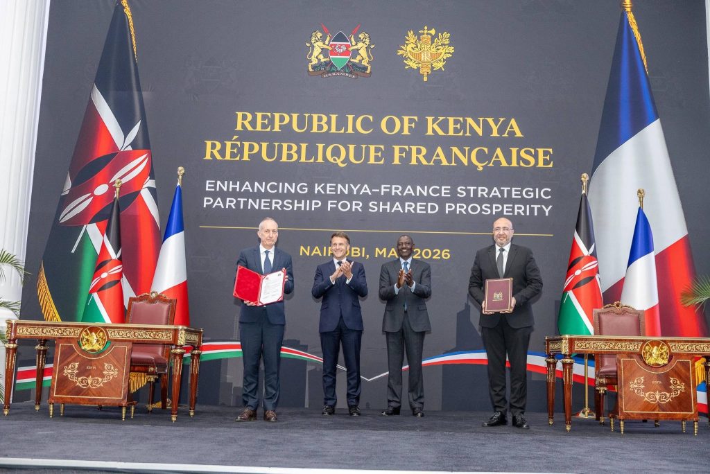Presidents William Ruto and Emanuel Macron during the signing.